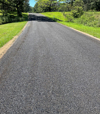 Rural access road resealed through open paddocks